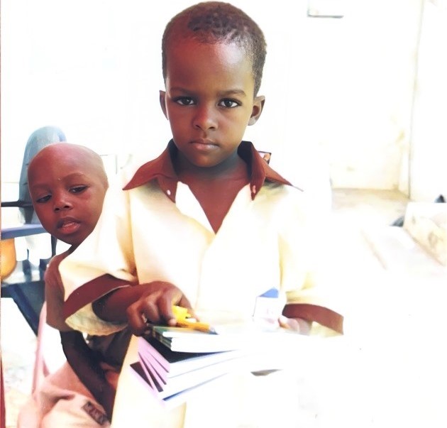 An Orphan supported with school materials